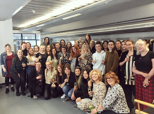 A class of makeup artistry students