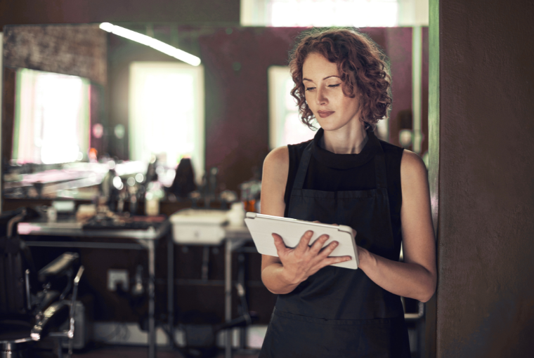 A busy stylist uses salon tech to manage her day