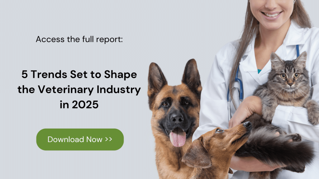 Image with veterinarian smiling while holding a cat and with two dogs.